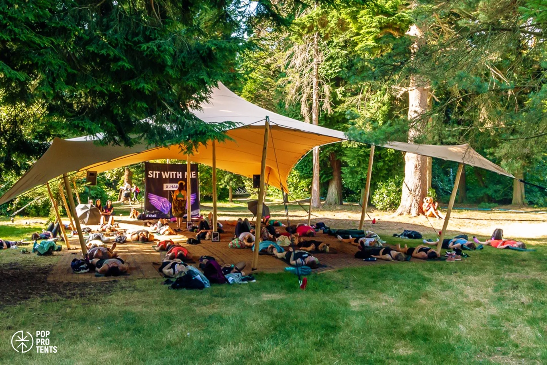 Stretch tent wellness yoga zone at outdoor festival
