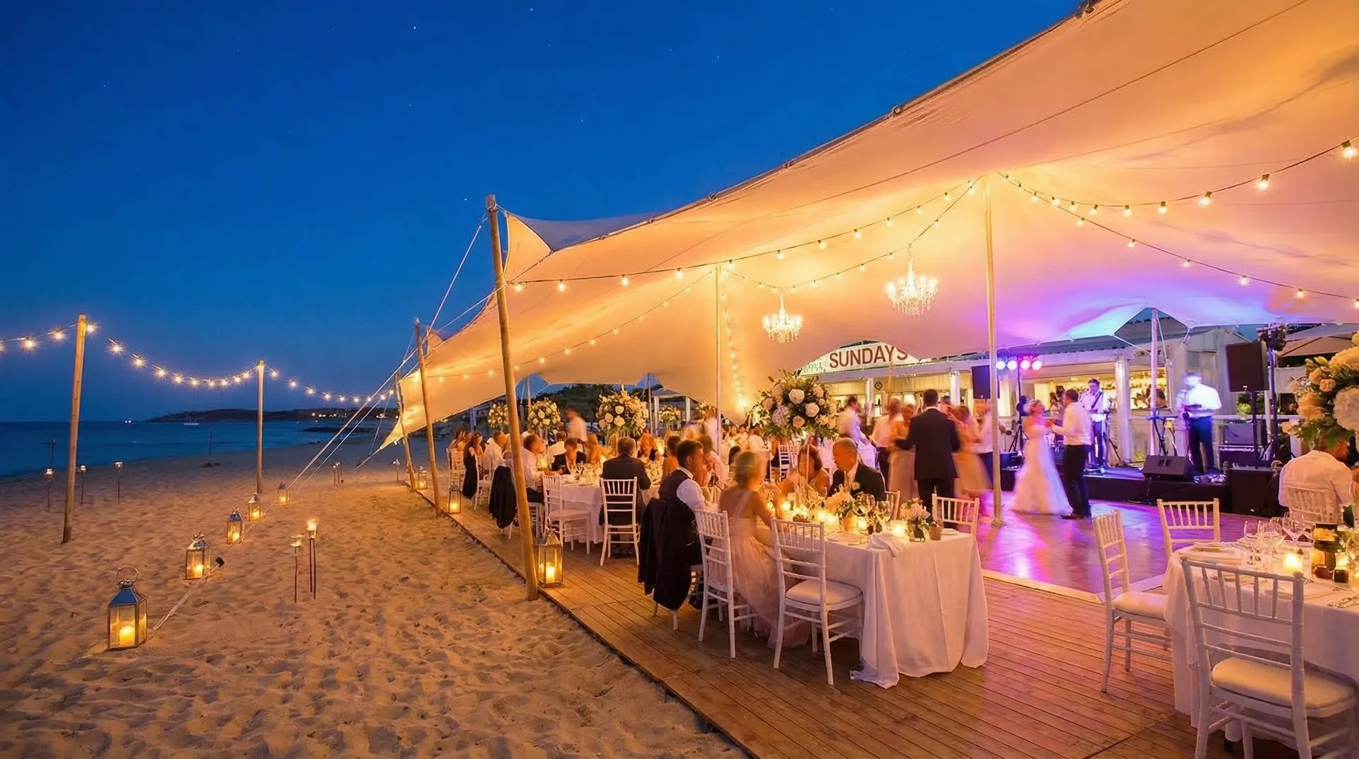 Wedding celebration under a Pop Pro Tents stretch tent