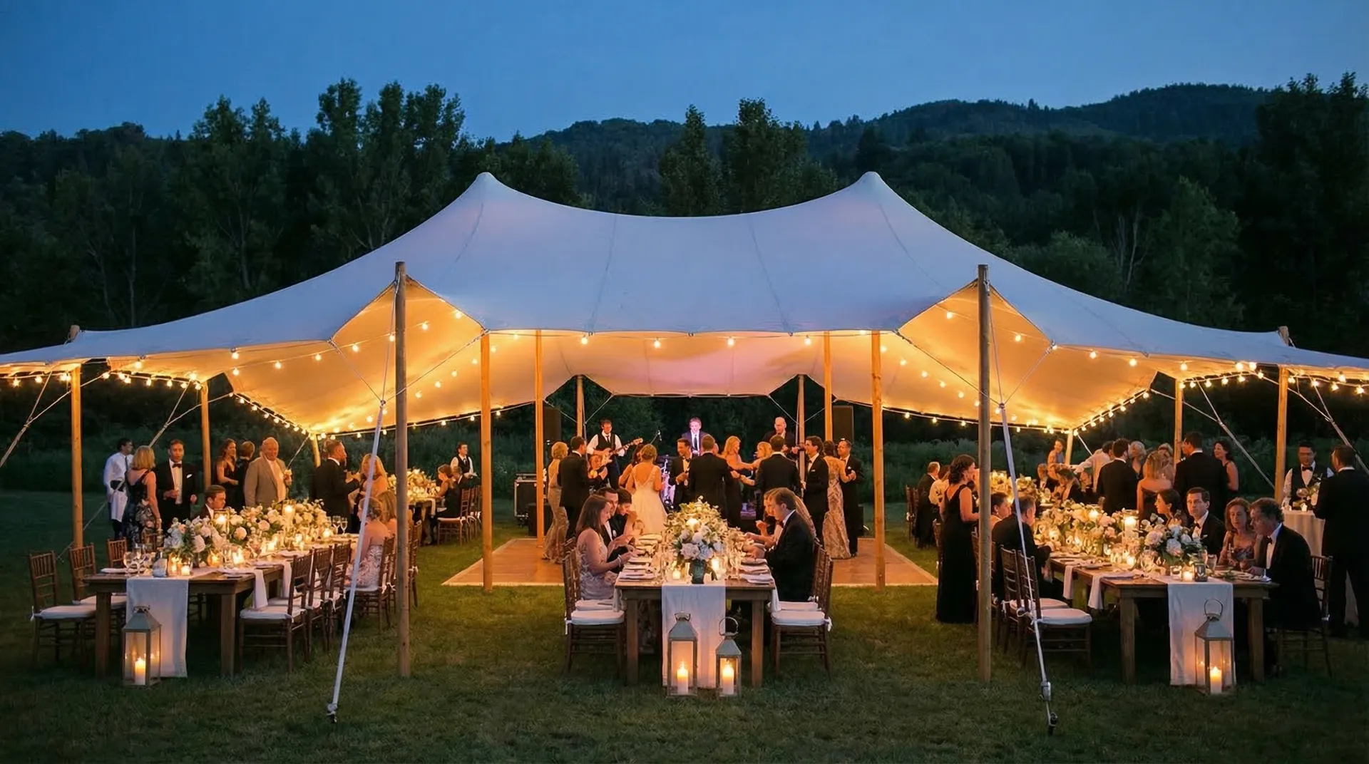 Garden wedding reception under a fairy-lit stretch tent